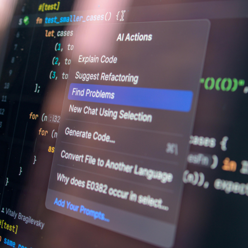 Office workspace with computer displaying multiple technology projects related to AI automation and system integration